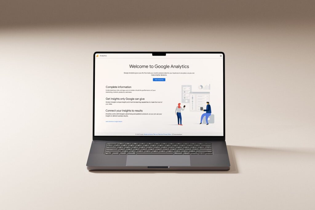Google Analytics for travel agents pulled up on a laptop, walkthrough guide by JetSite & Roam