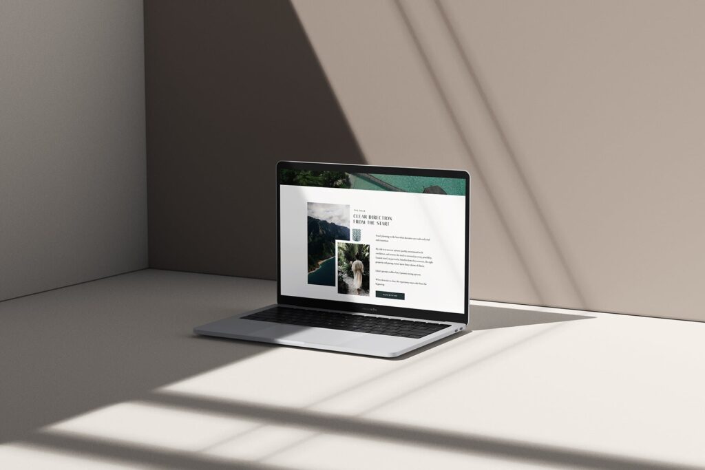 Mockup of a travel advisor website on a laptop, in a minimalist setting