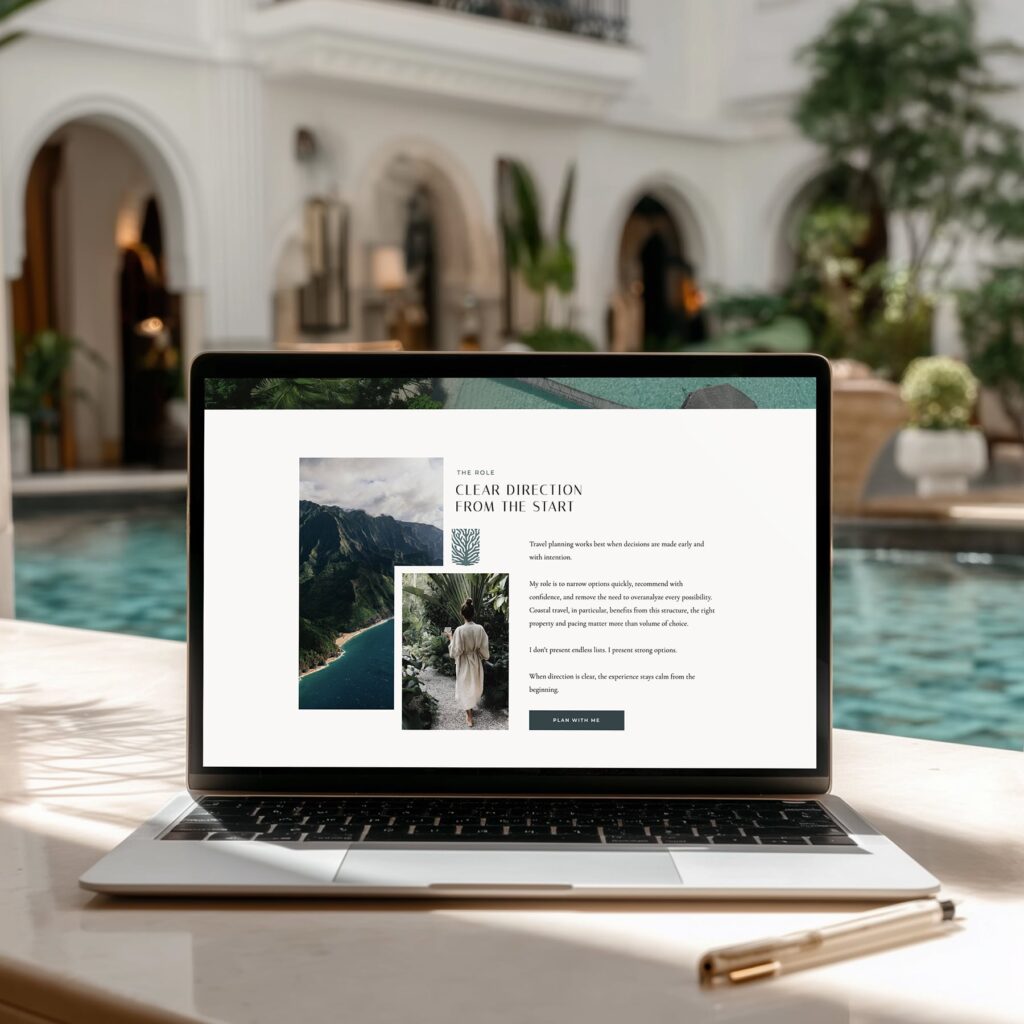 laptop by a resort pool with a travel agency website on screen